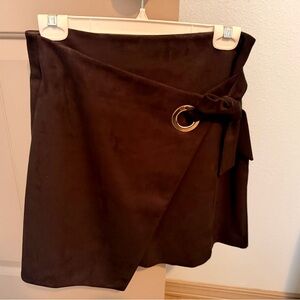 Navy blue Loft suede like skirt with side “buckle sash” detail. Size 2